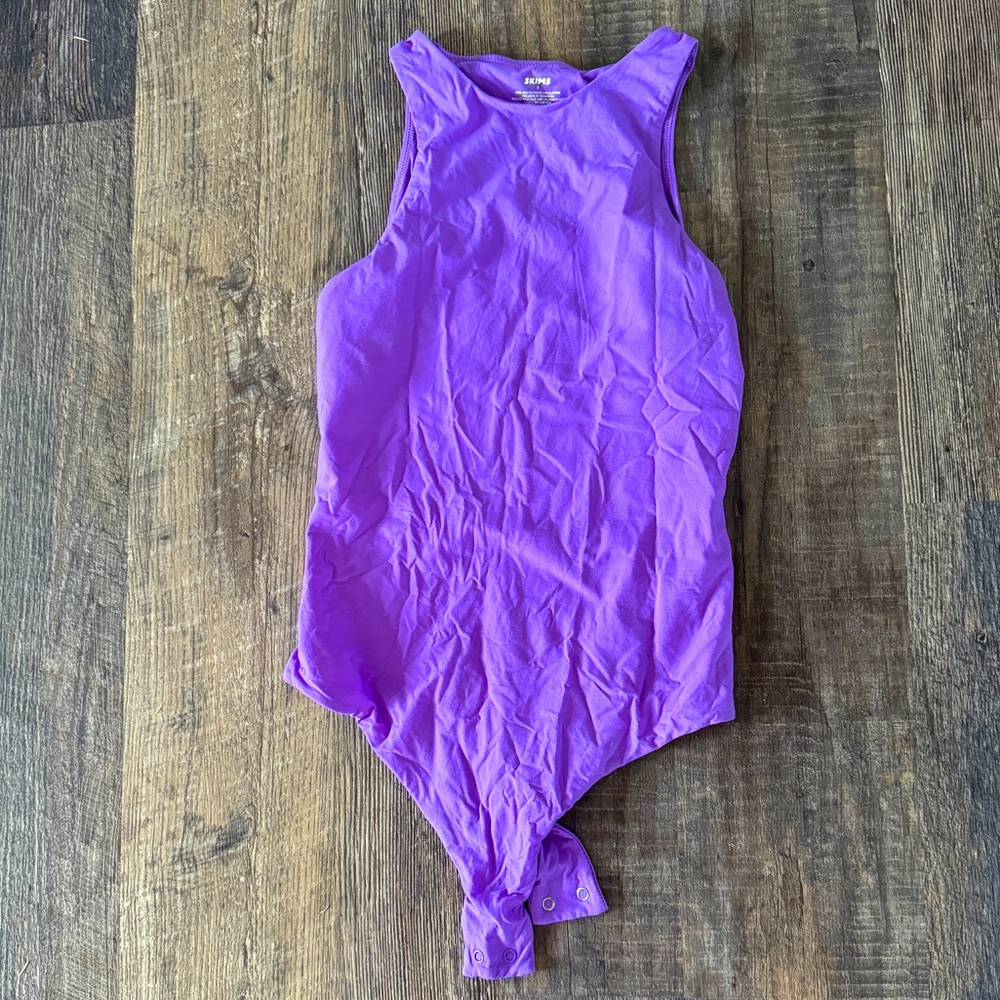 Skims purple bodysuit, never worn. Size small